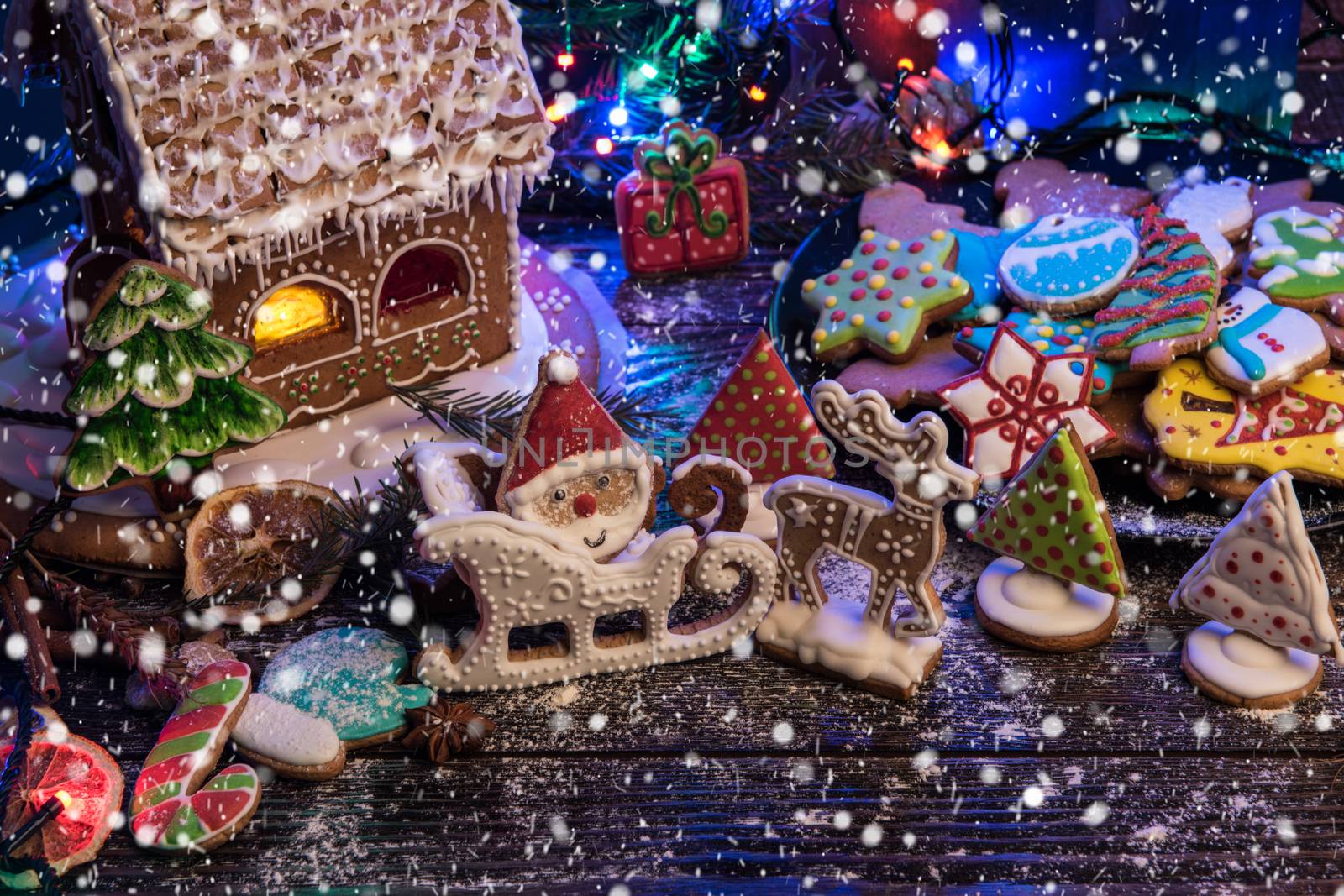 Gingerbreads for new years and christmas on wooden background, xmas theme