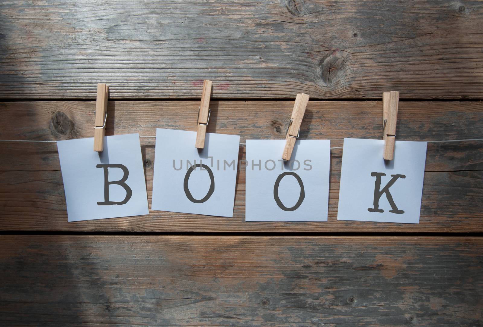 Notes spelling book hanging on washing line