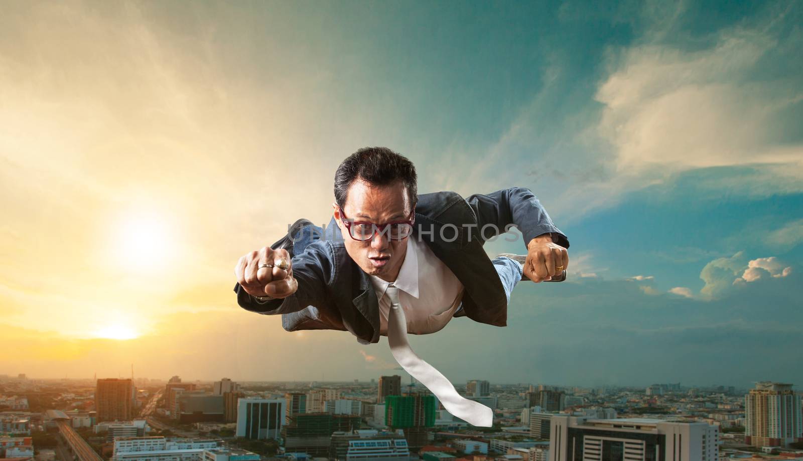 business man flying over skyscraper for business successful and  by khunaspix