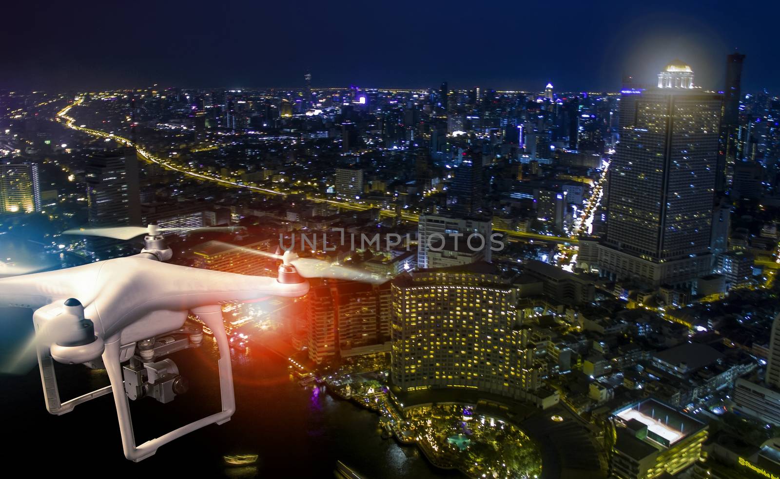 aerial view of using drone to take a photography of skyscraper a by khunaspix