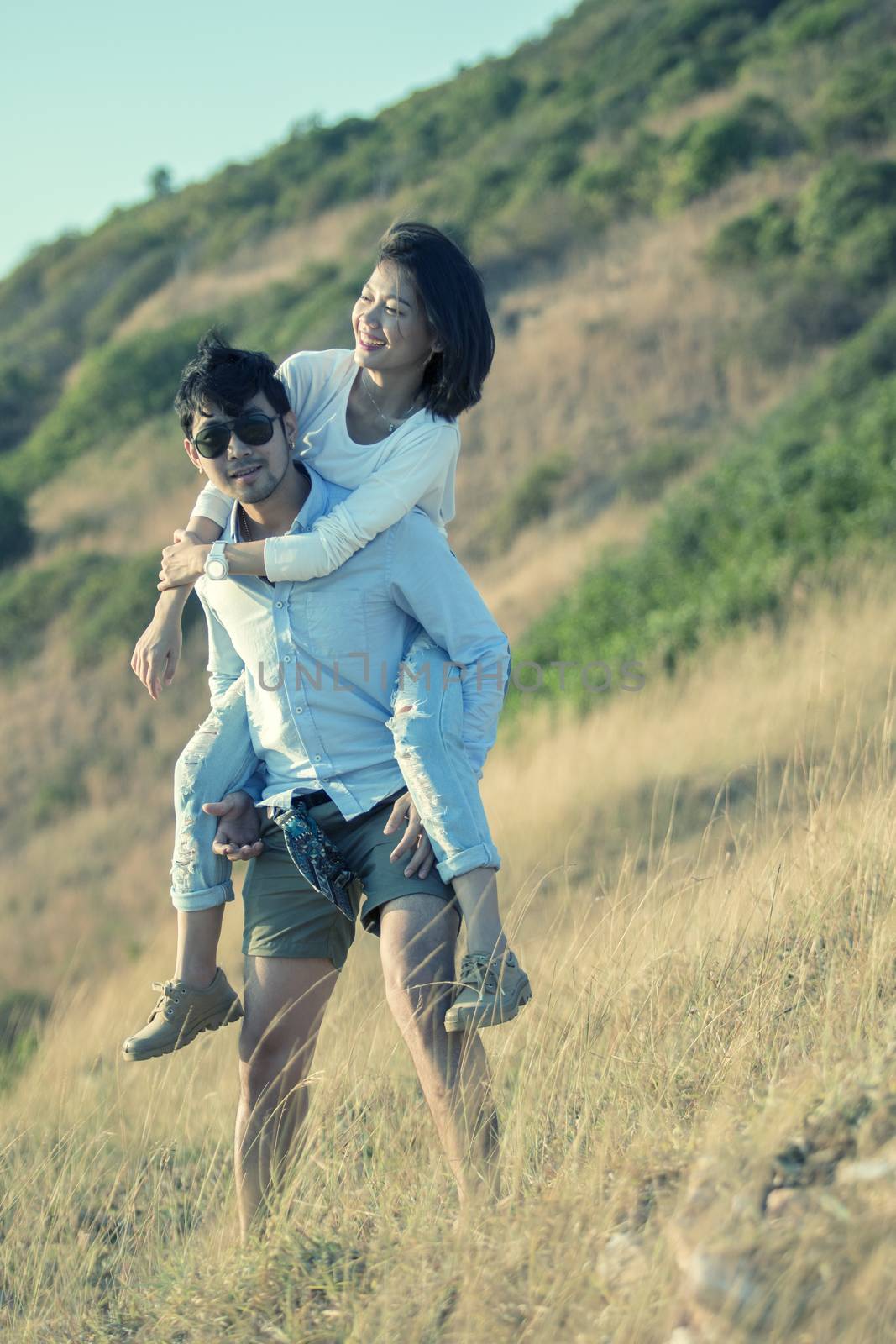 couples of younger man and woman in love relaxing vacation outdoor lifestyle