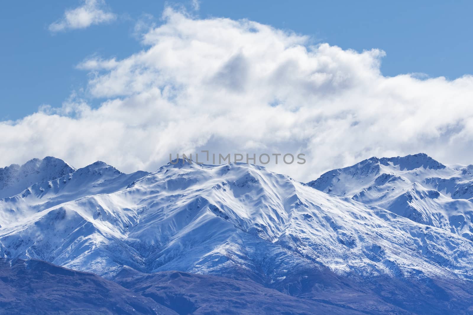 peak of mountain snow with white cloud and blue sky