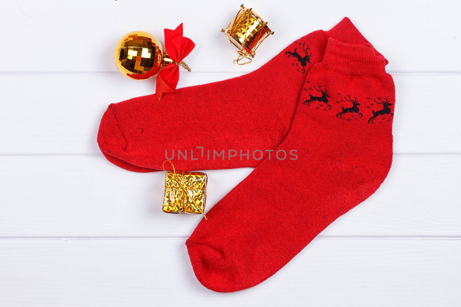 Christmas red socks on a white wooden background