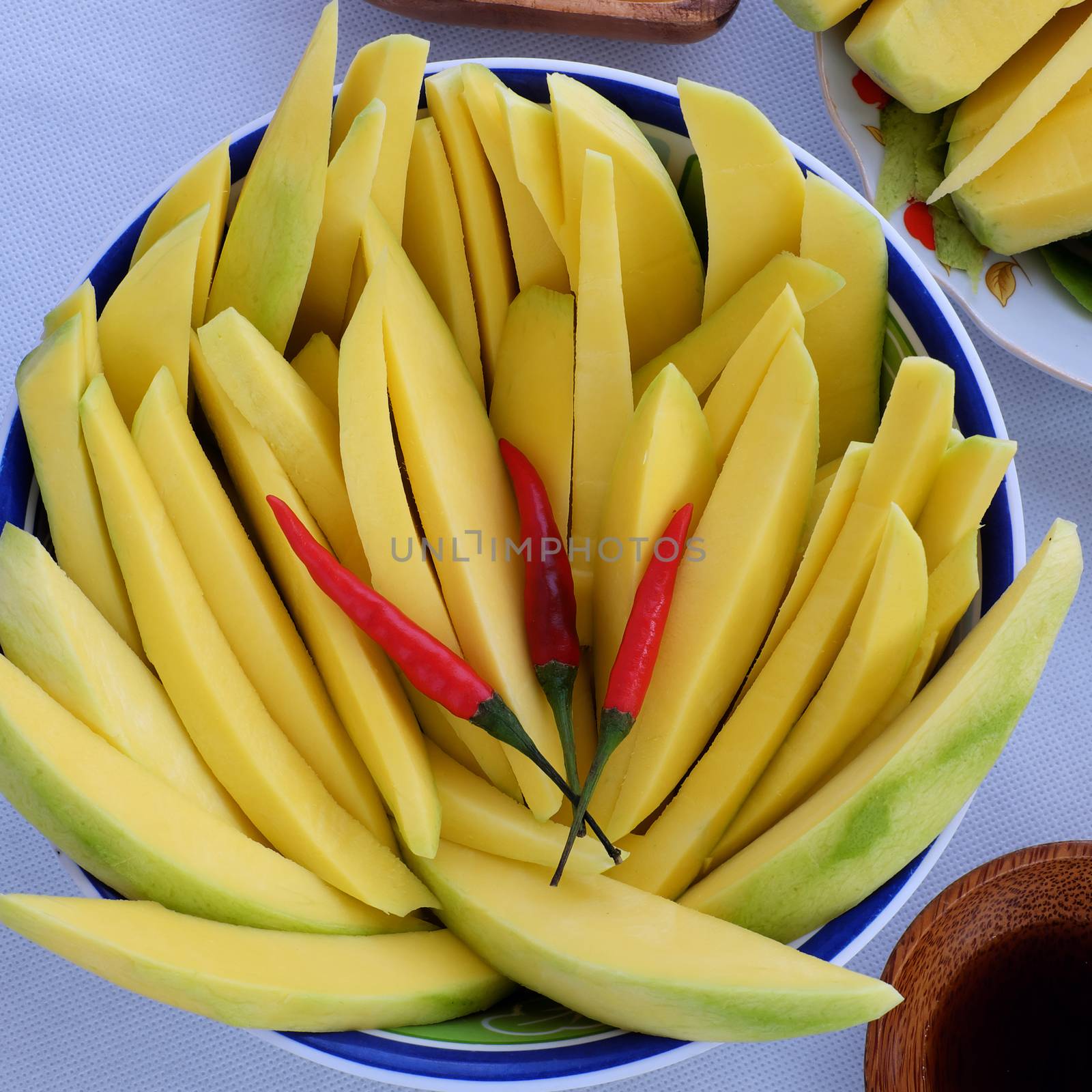 Vietnamese fruit, green mango cut in slice, a popular tropical fruit, rich vitamin A, vitamin C, collagen, good for health and impulse calcium absorption