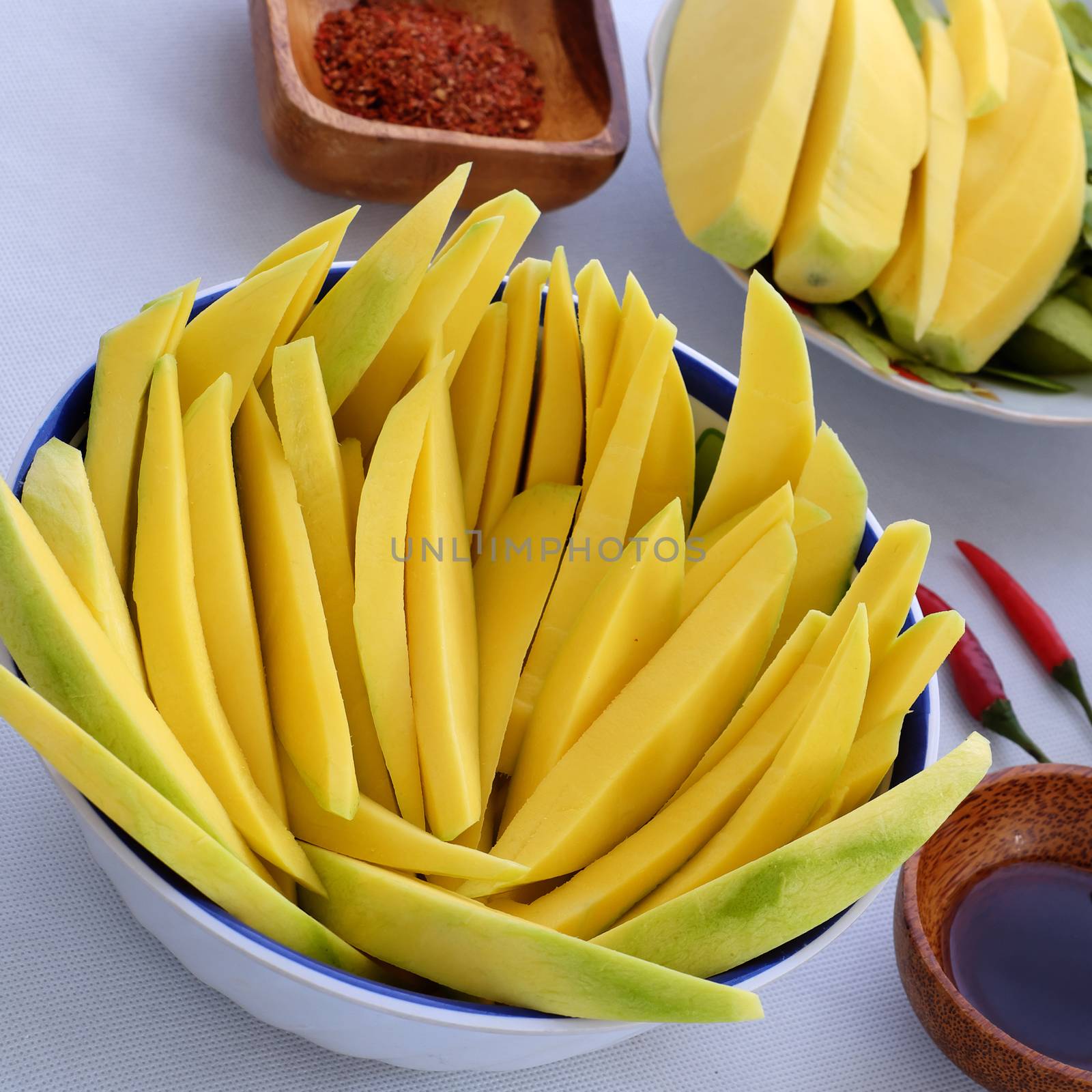 Vietnamese fruit, green mango cut in slice, a popular tropical fruit, rich vitamin A, vitamin C, collagen, good for health and impulse calcium absorption