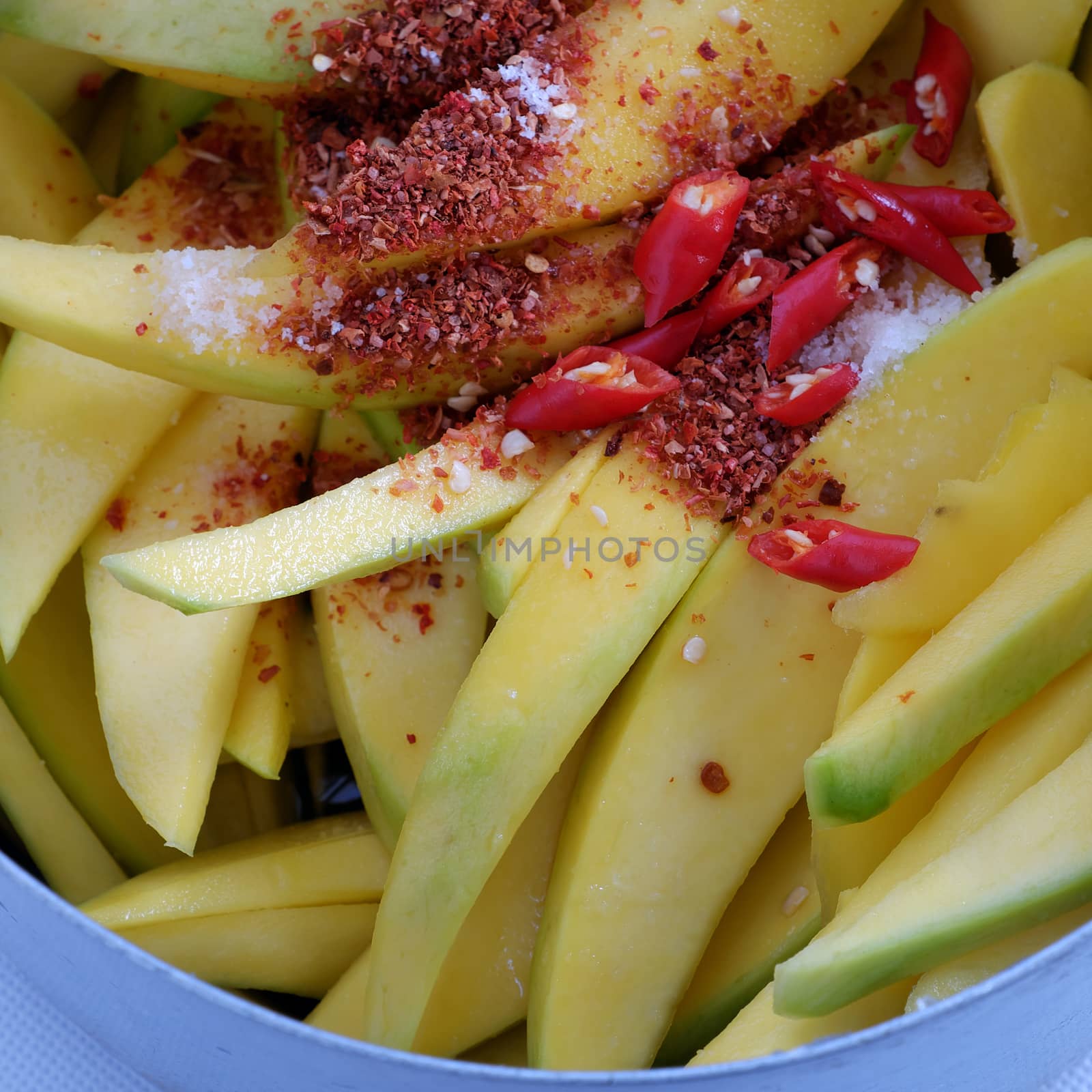 Vietnamese fruit, green mango cut in slice, a popular tropical fruit, rich vitamin A, vitamin C, collagen, good for health and impulse calcium absorption