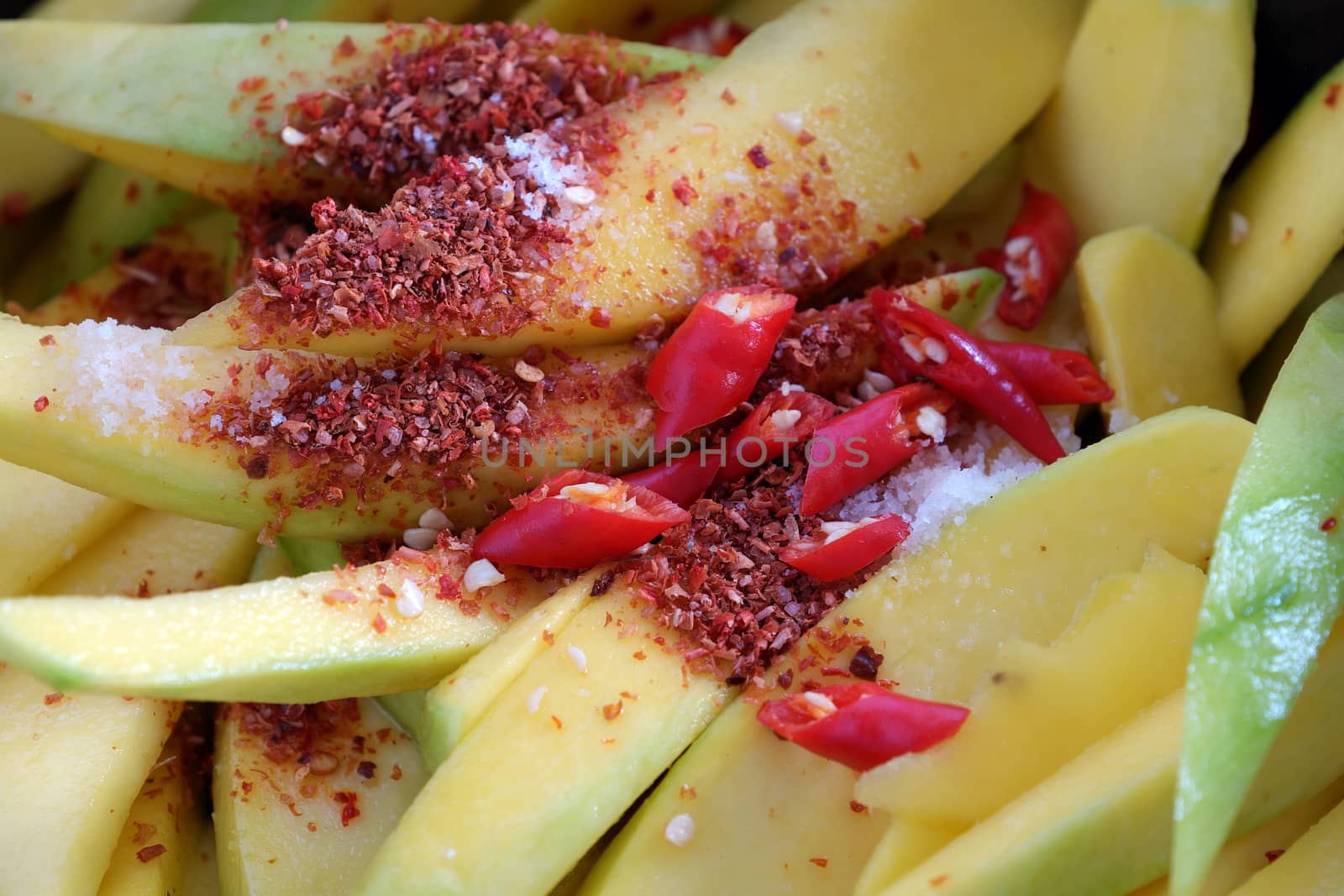 Vietnamese fruit, green mango cut in slice, a popular tropical fruit, rich vitamin A, vitamin C, collagen, good for health and impulse calcium absorption
