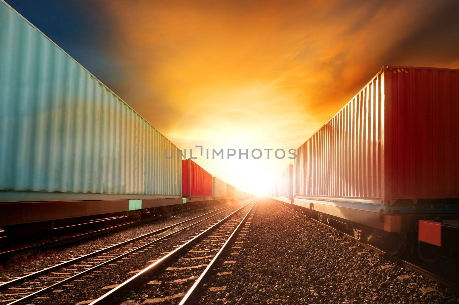 industry container trainst running on railways track against beautiful sun set sky use for land transport and logistic business 