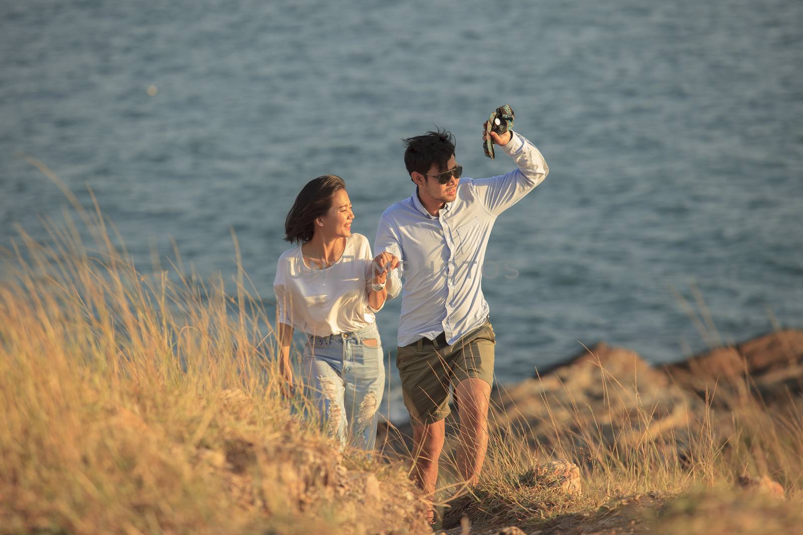 couples of younger man and woman in love relaxing vacation outdoor lifestyle 