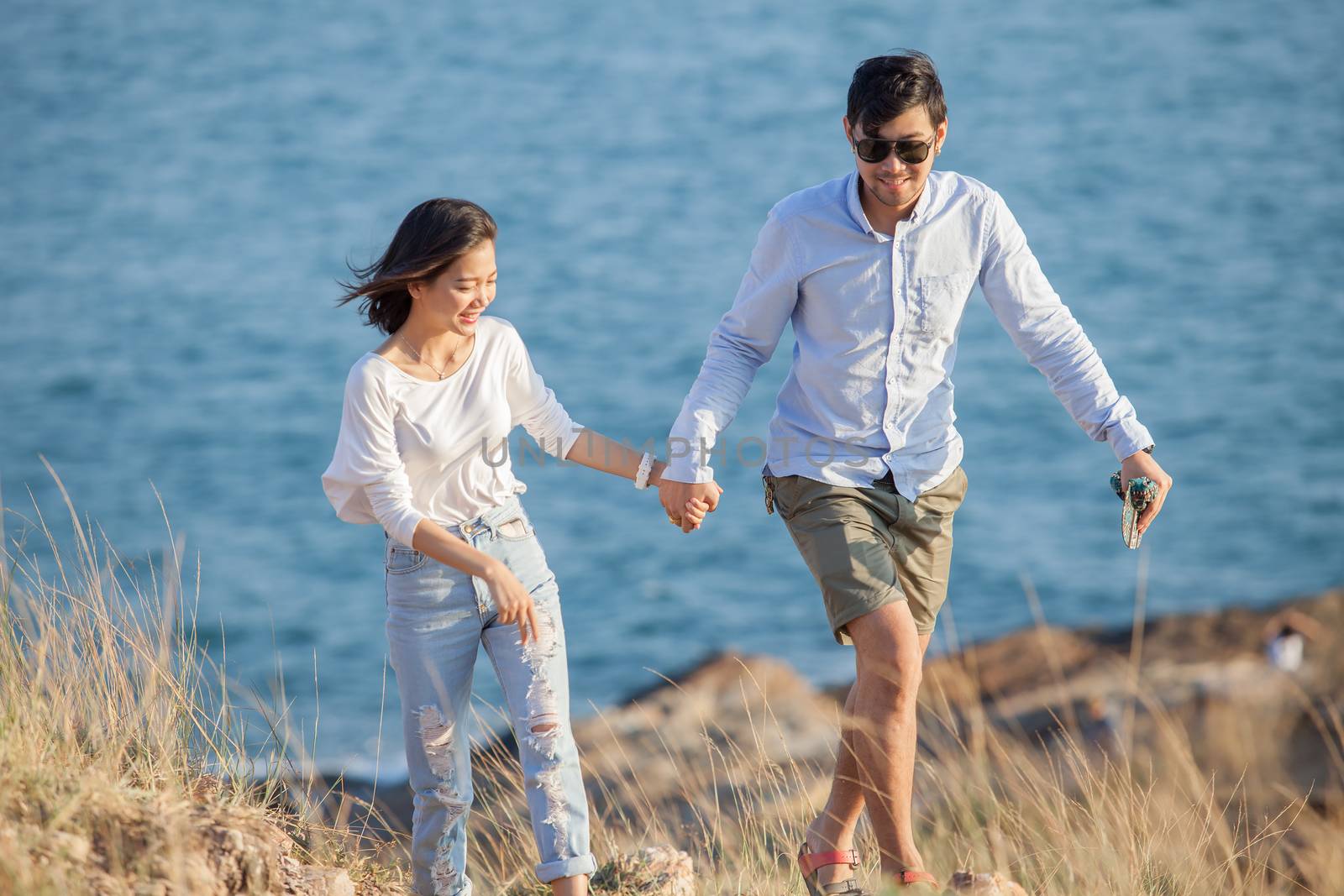 couples of younger man and woman in love relaxing vacation outdoor lifestyle 