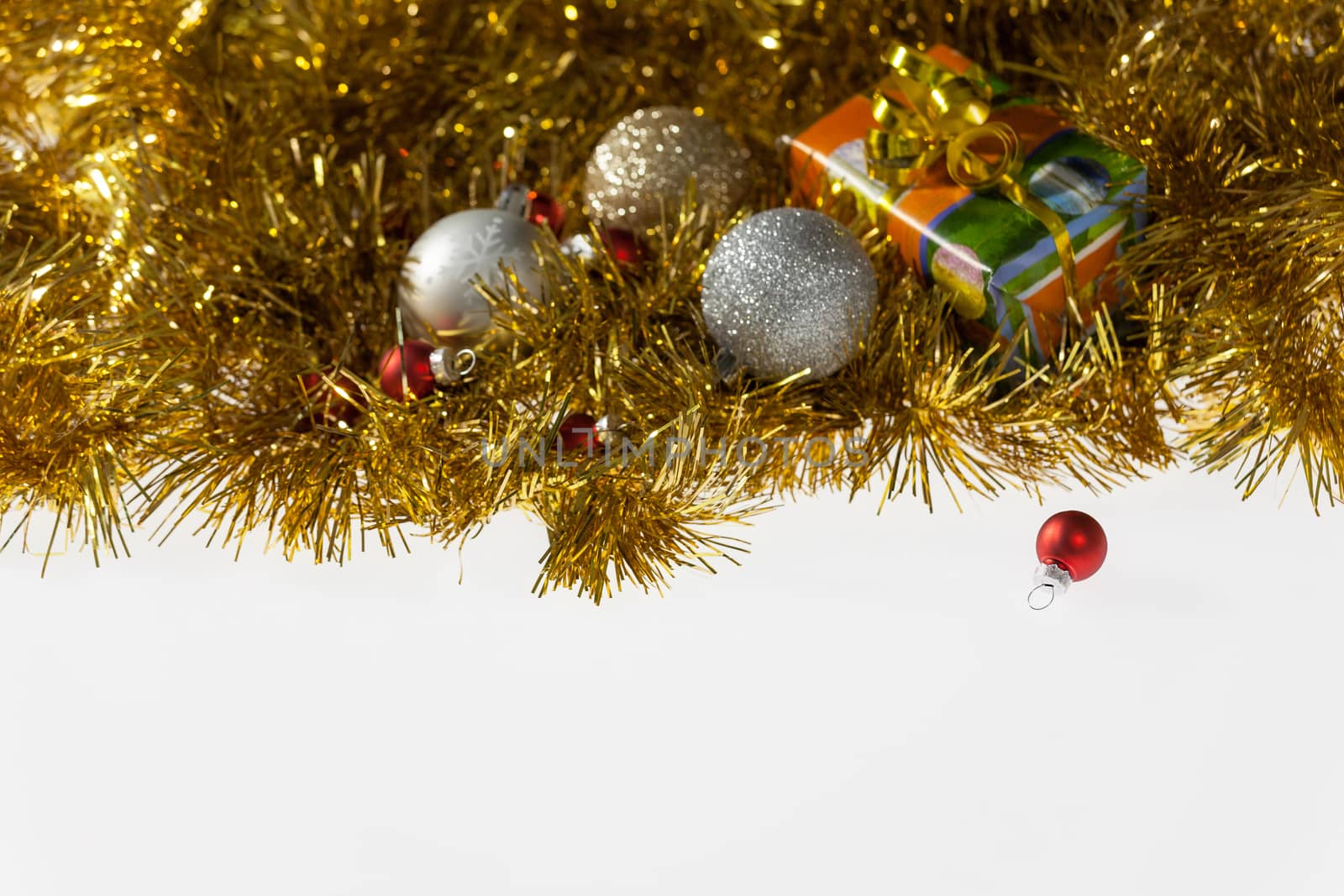 Christmas balls and present on a white background