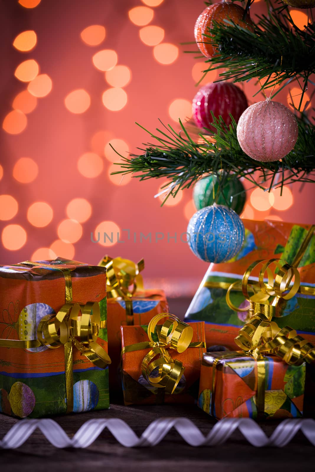 Christmas gifts with blurred lights and ribbon by LuigiMorbidelli