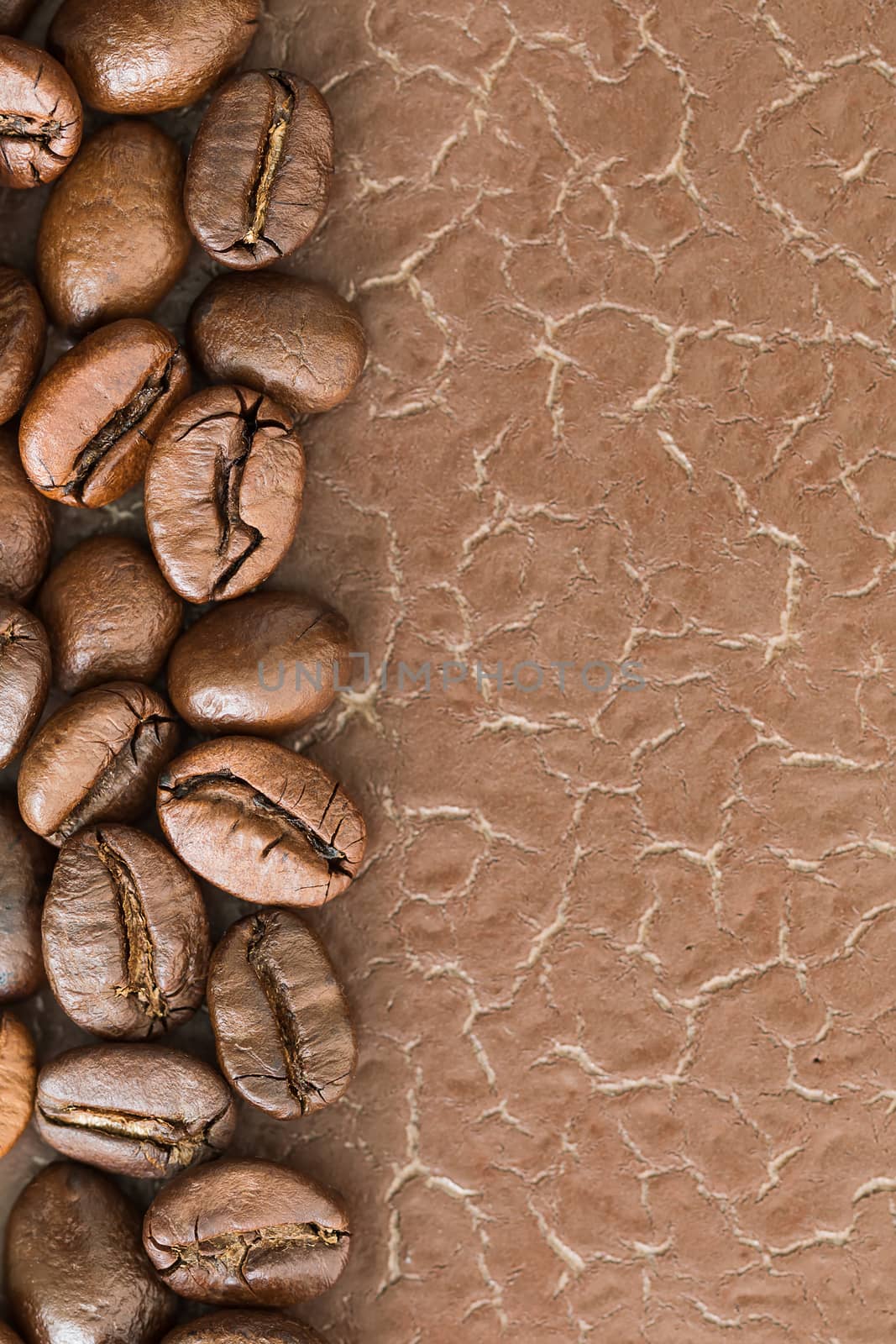 Top view close up brown roasted coffee beans background with copy space