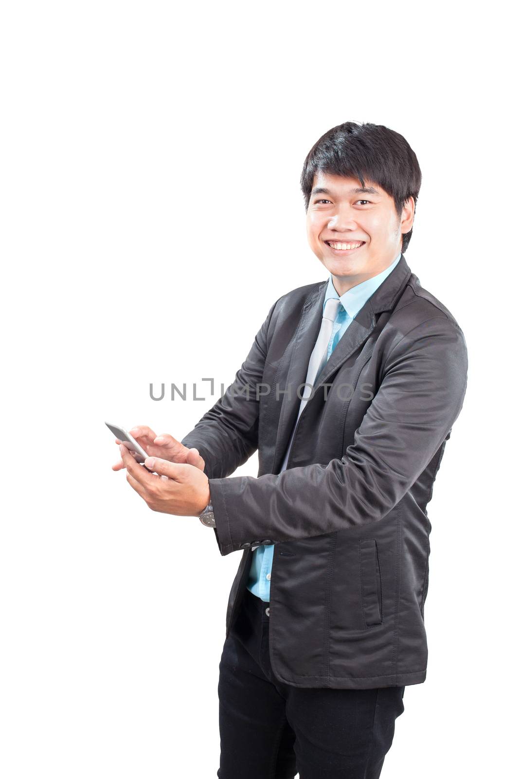 younger business man toothy smiling face with happiness emotion touching on smart phone screen isolated white background