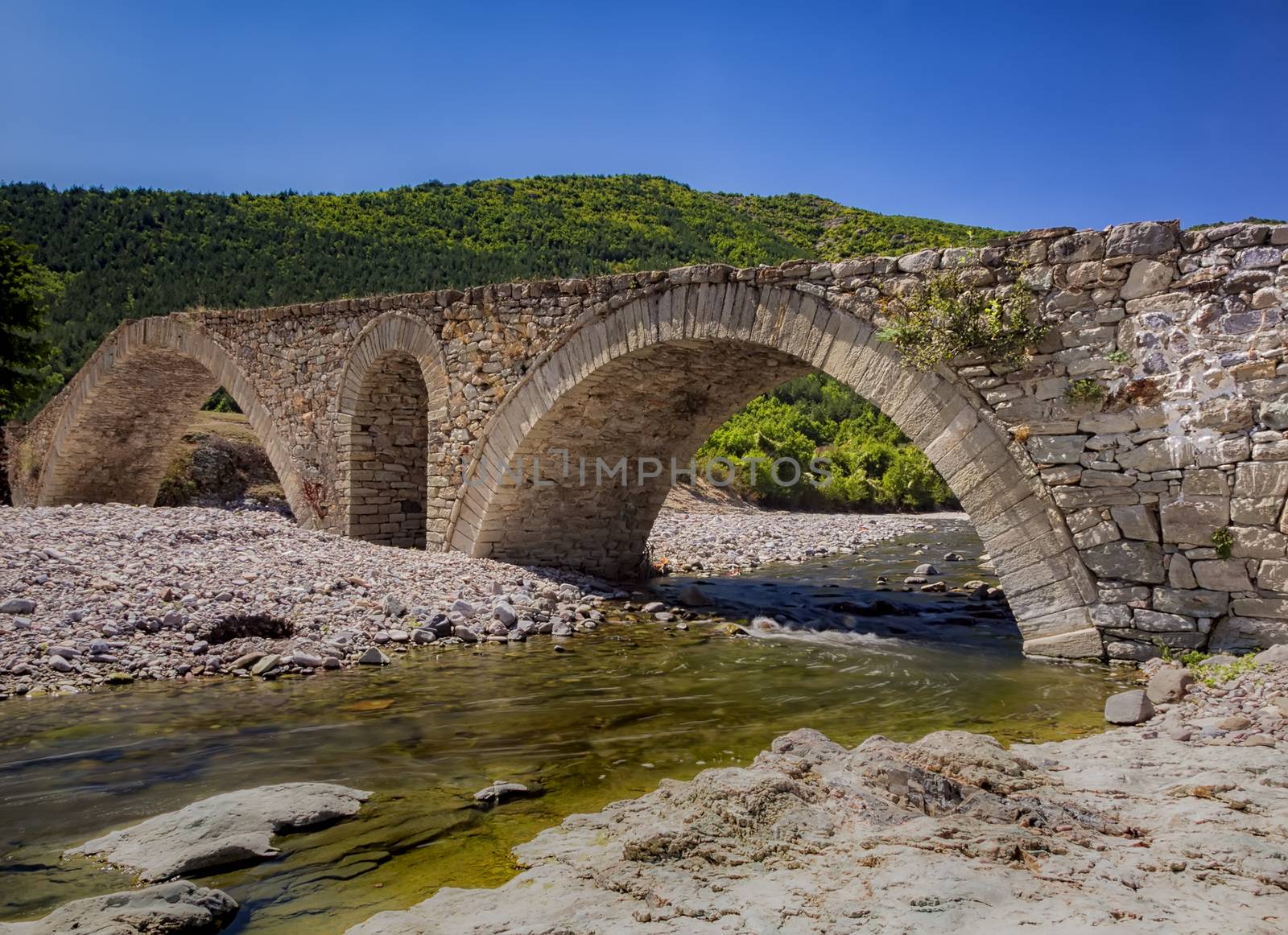 day view of old Roman stone bridge near village Nenkovo. Bulgaria