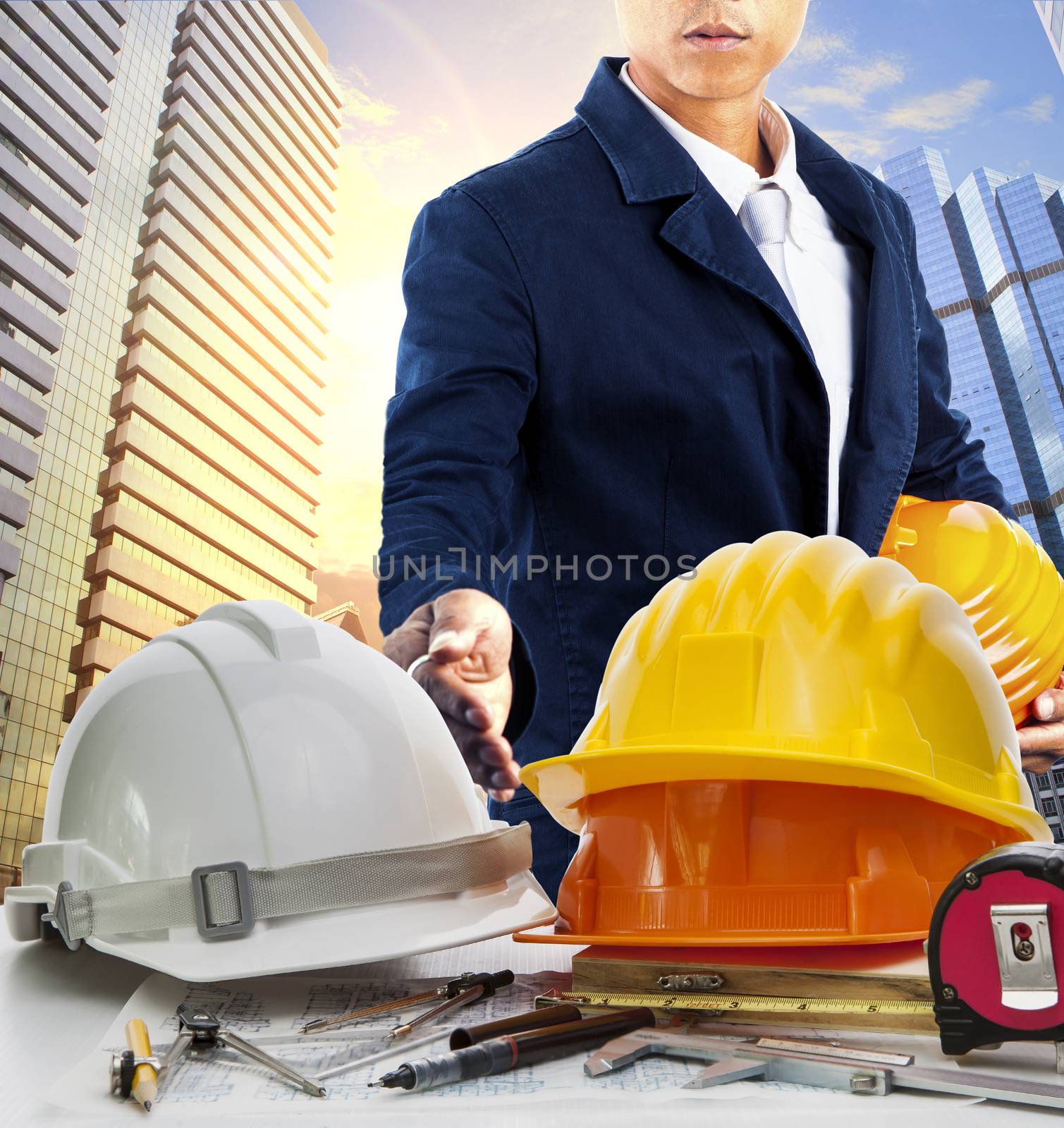 engineer man and working table against sky scrapper in urban scene use for land development and architecture occupation theme