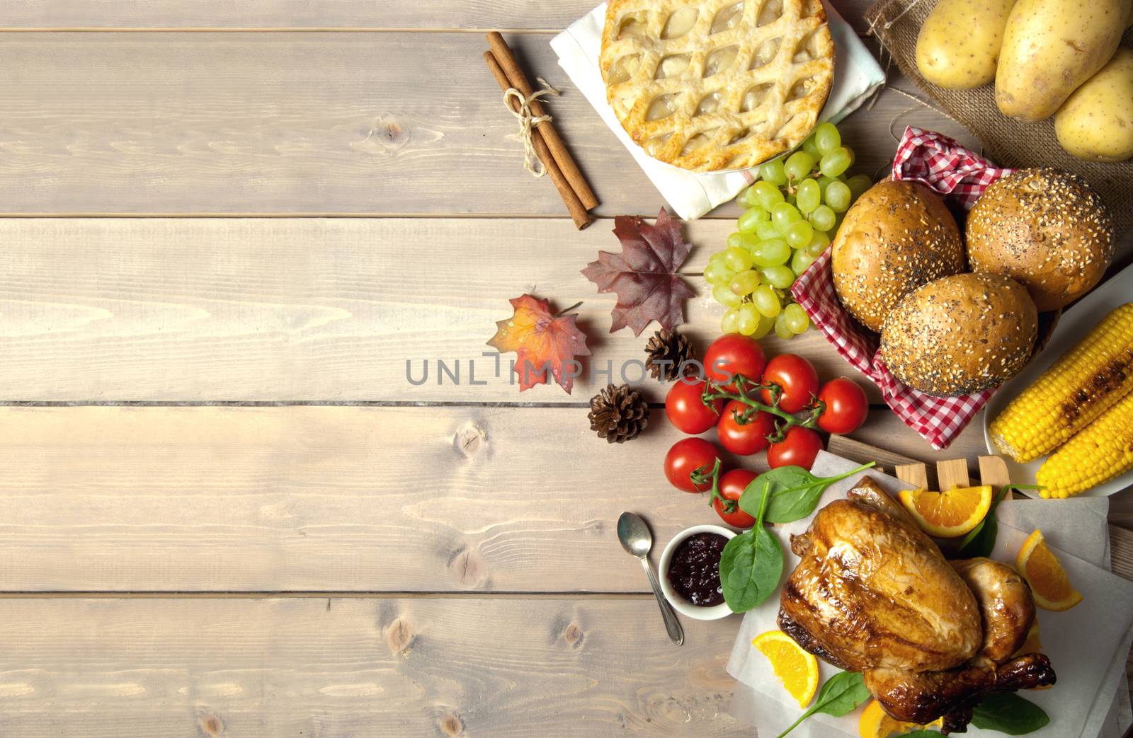 Thanksgiving savory and sweet food selection on top of a wooden background with copyspace 