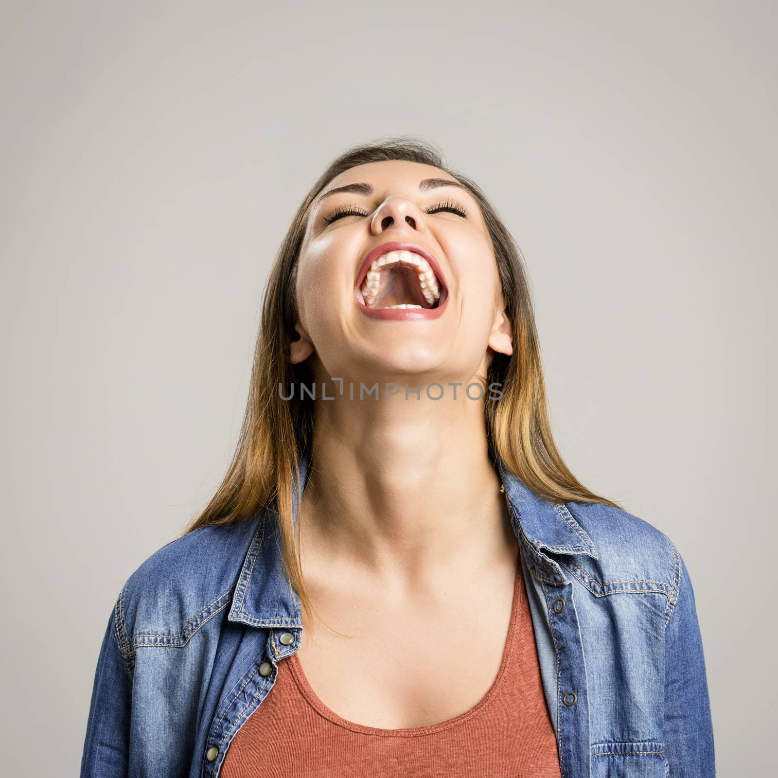 Portrait of a beautiful and happy woman laughing