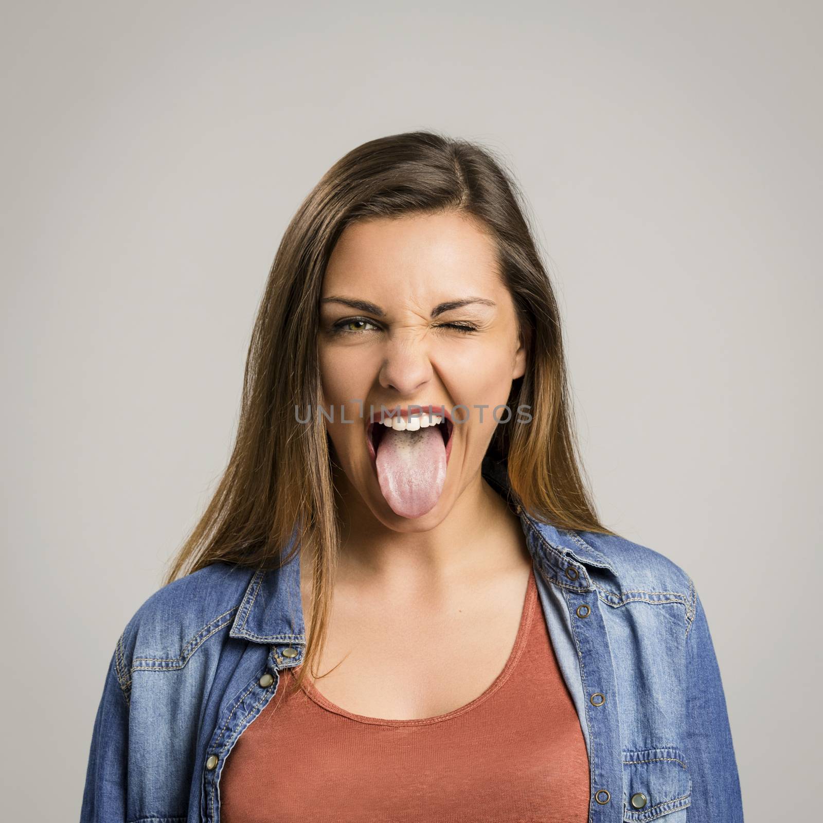 Woman with tongue out by Iko