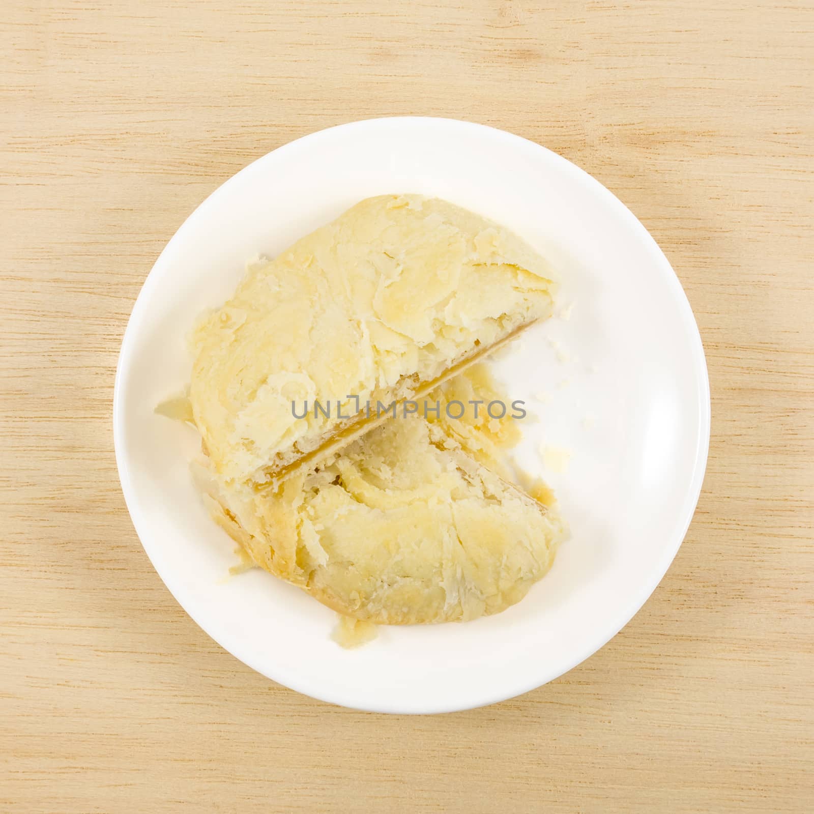 The Taiwanese sun cake (milk butter pastry) on the small white dish.