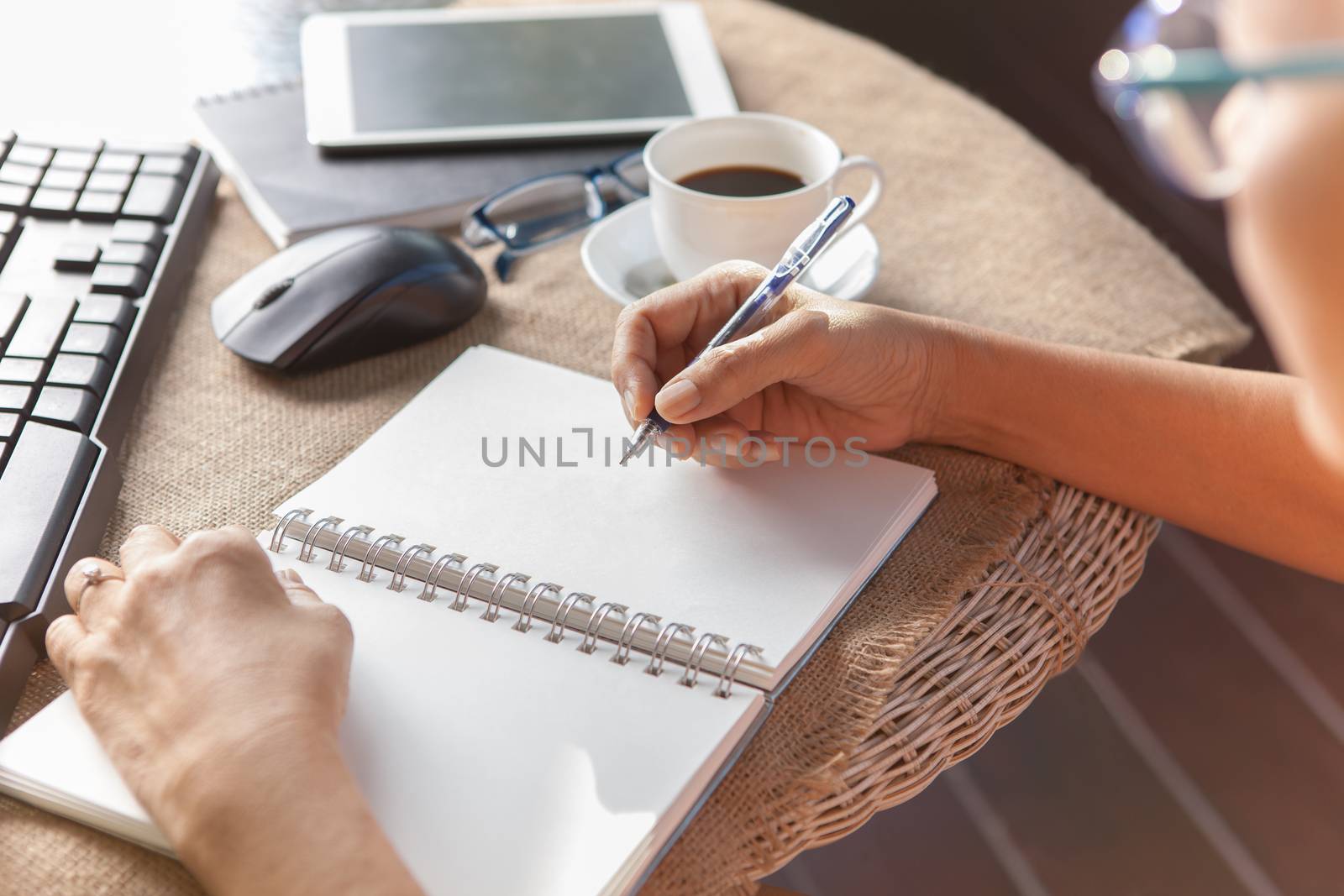 woman writing shot memories note on white paper with relaxing time and emotion