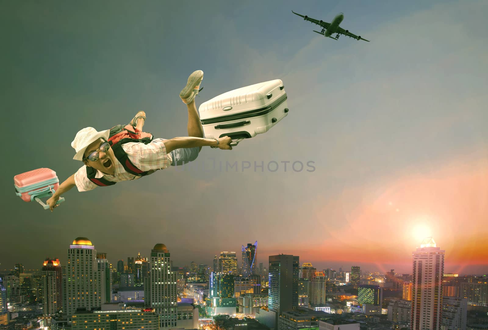 younger man flying mid air with belonging luggage and passenger plane over beautiful scenic of sky scrapper at dusky time