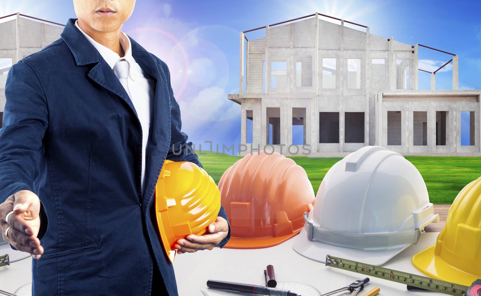 architect with architecture working table and home construction background use for housing and land development