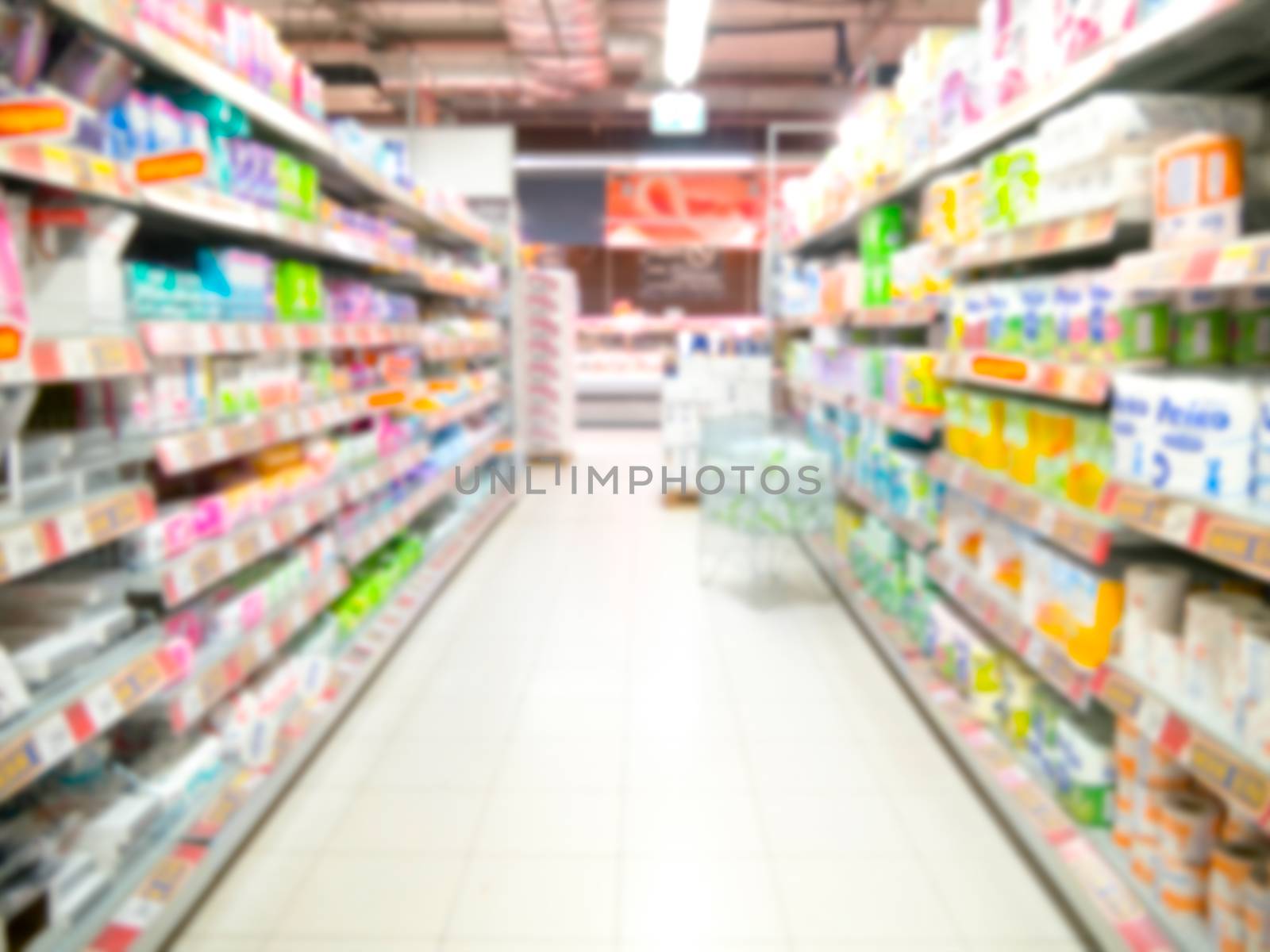 Abstract blurred supermarket aisle with colorful shelves by fascinadora