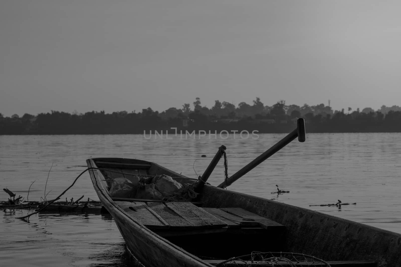 Wooden fishing boats on the Mekong River. by N_u_T