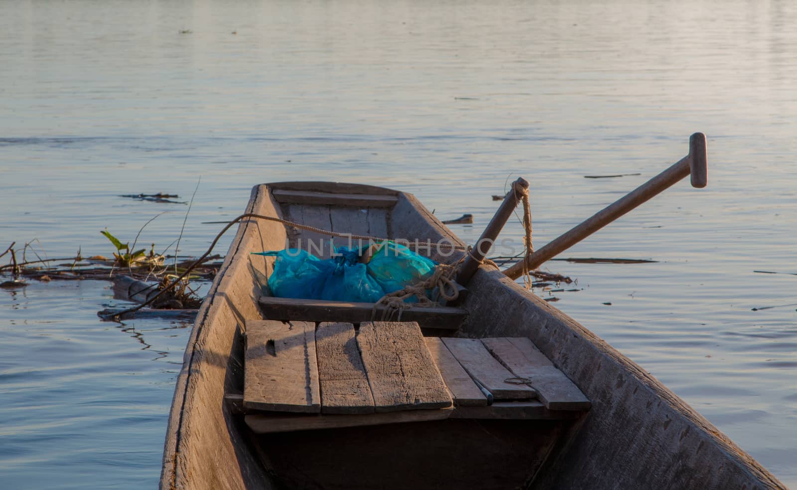 Wooden fishing boats on the Mekong River. by N_u_T