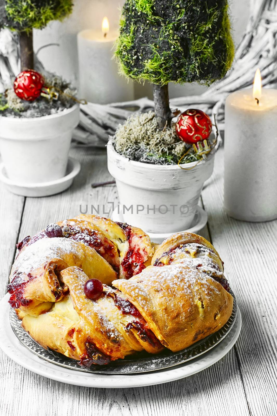 Christmas baked muffin in the background with candles