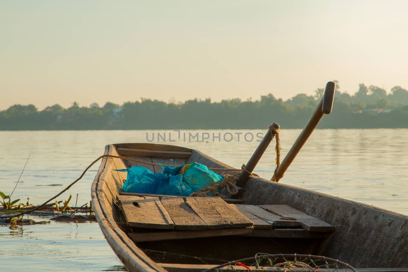 Wooden fishing boats on the Mekong River. by N_u_T