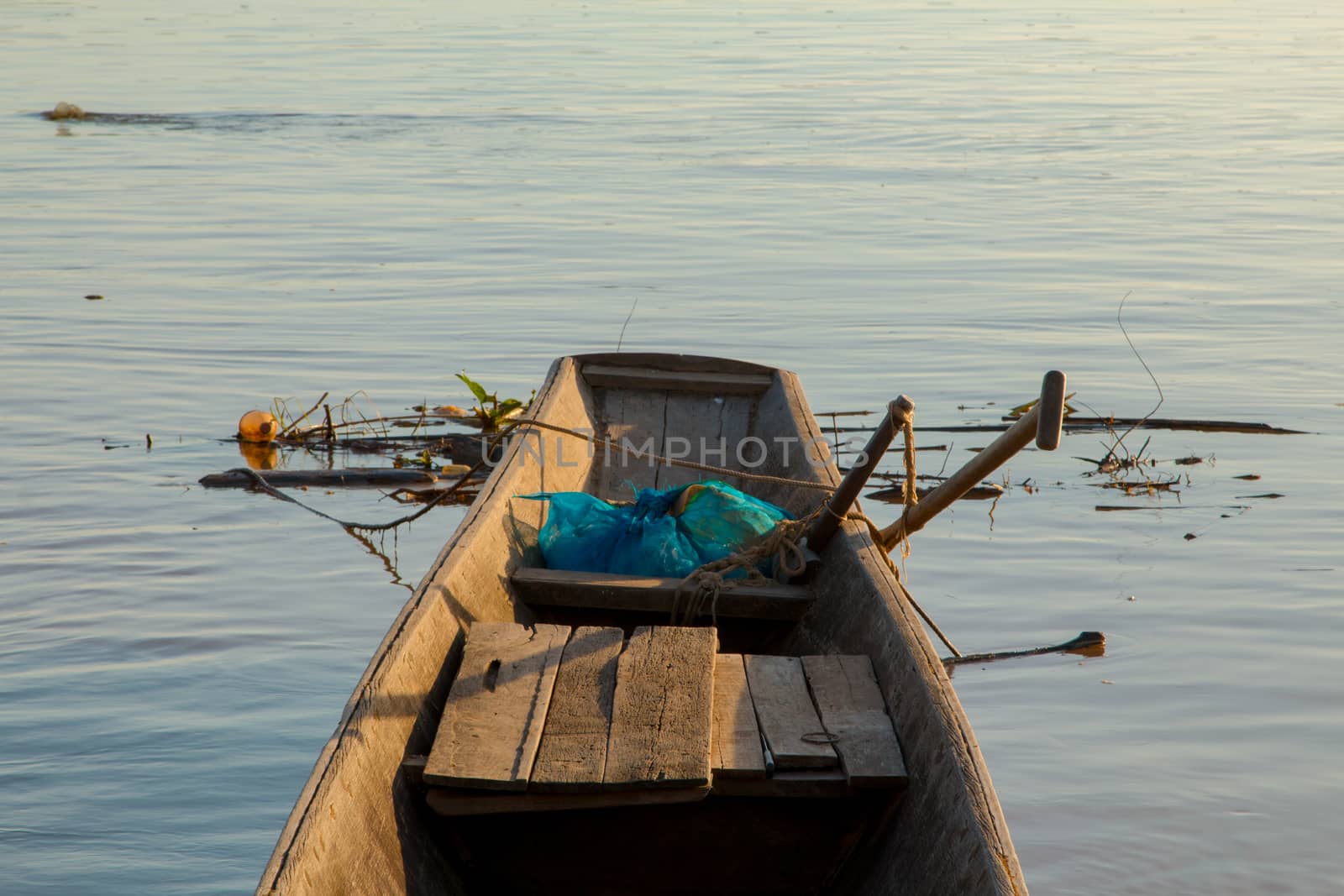 Wooden fishing boats on the Mekong River. by N_u_T