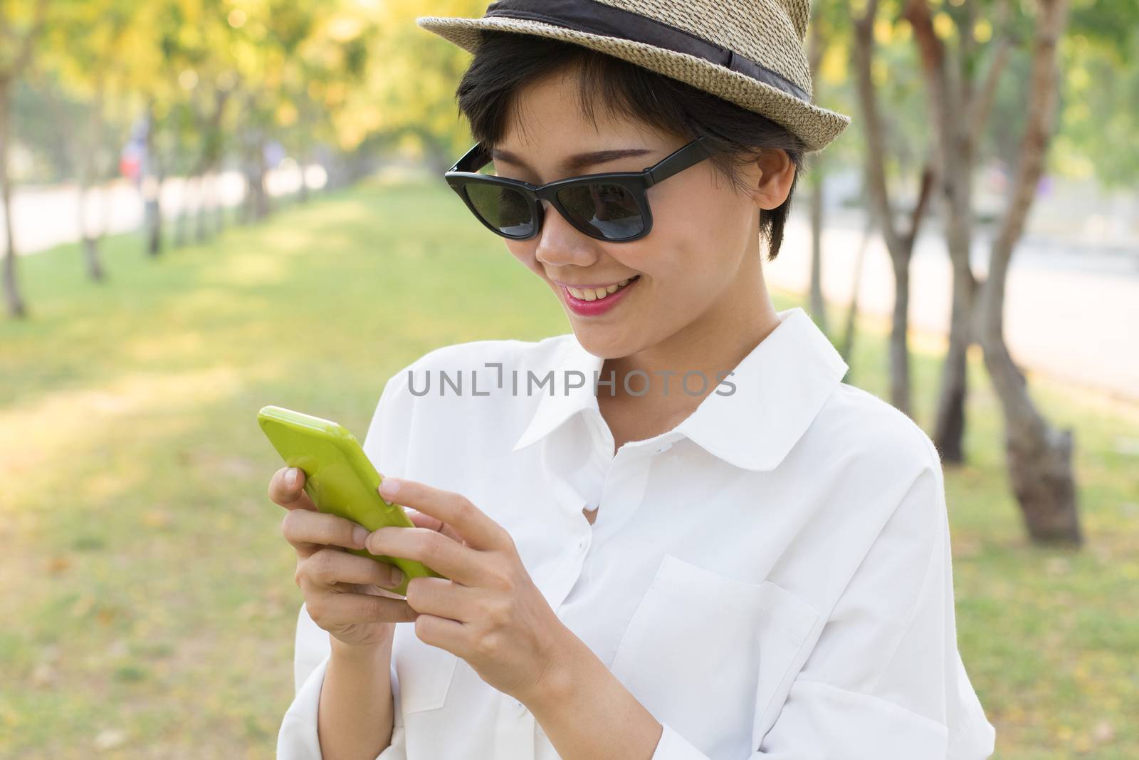 portrait of young beautiful asian woman and smart phone in hand smiling toothy face connecting mobile phone in hand use for people modern life style in digital trend
