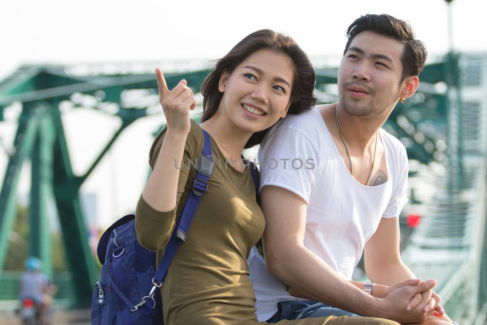 couples of younger asian man and woman relaxing with happy face  by khunaspix