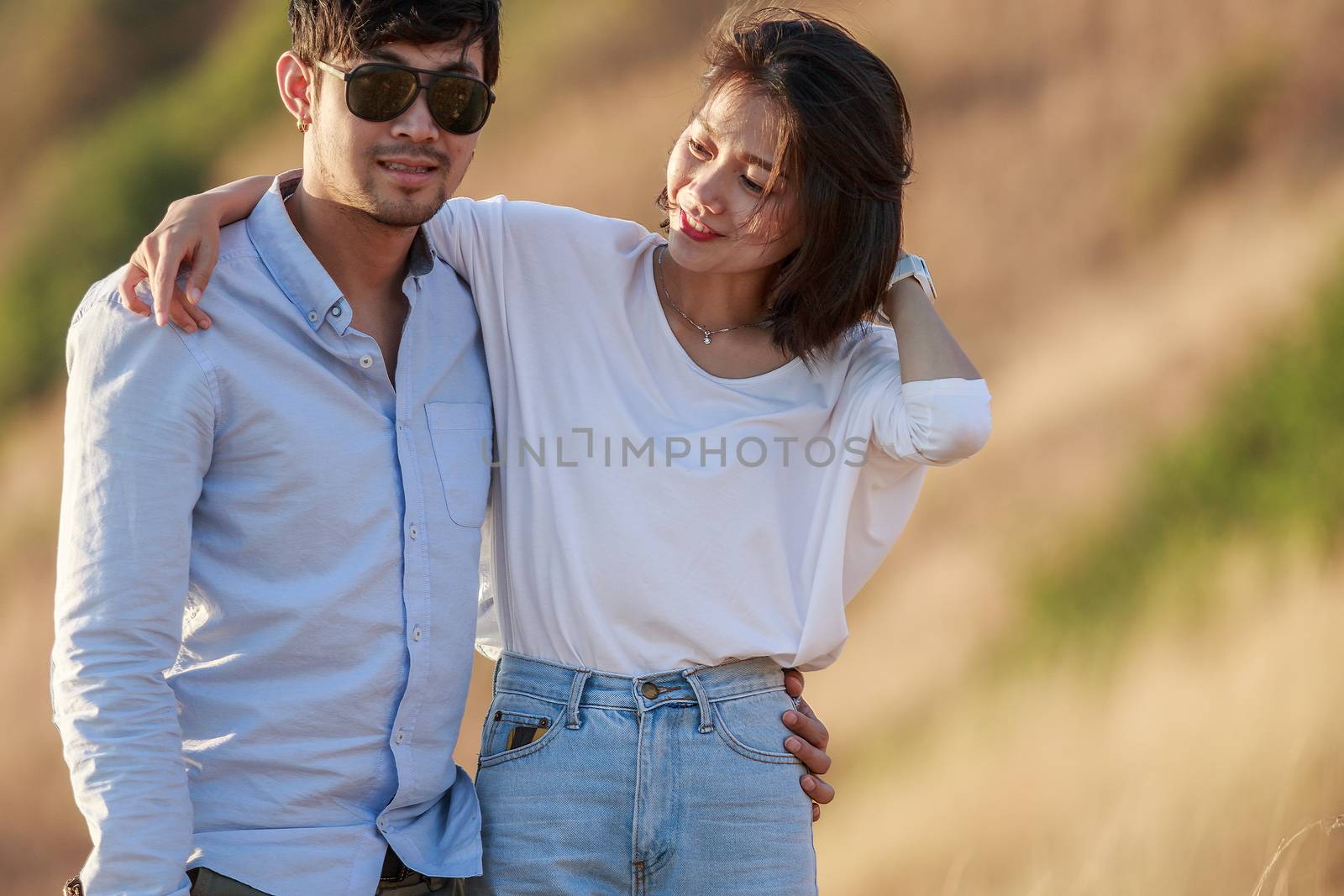 couples of younger man and woman in love relaxing vacation outdo by khunaspix