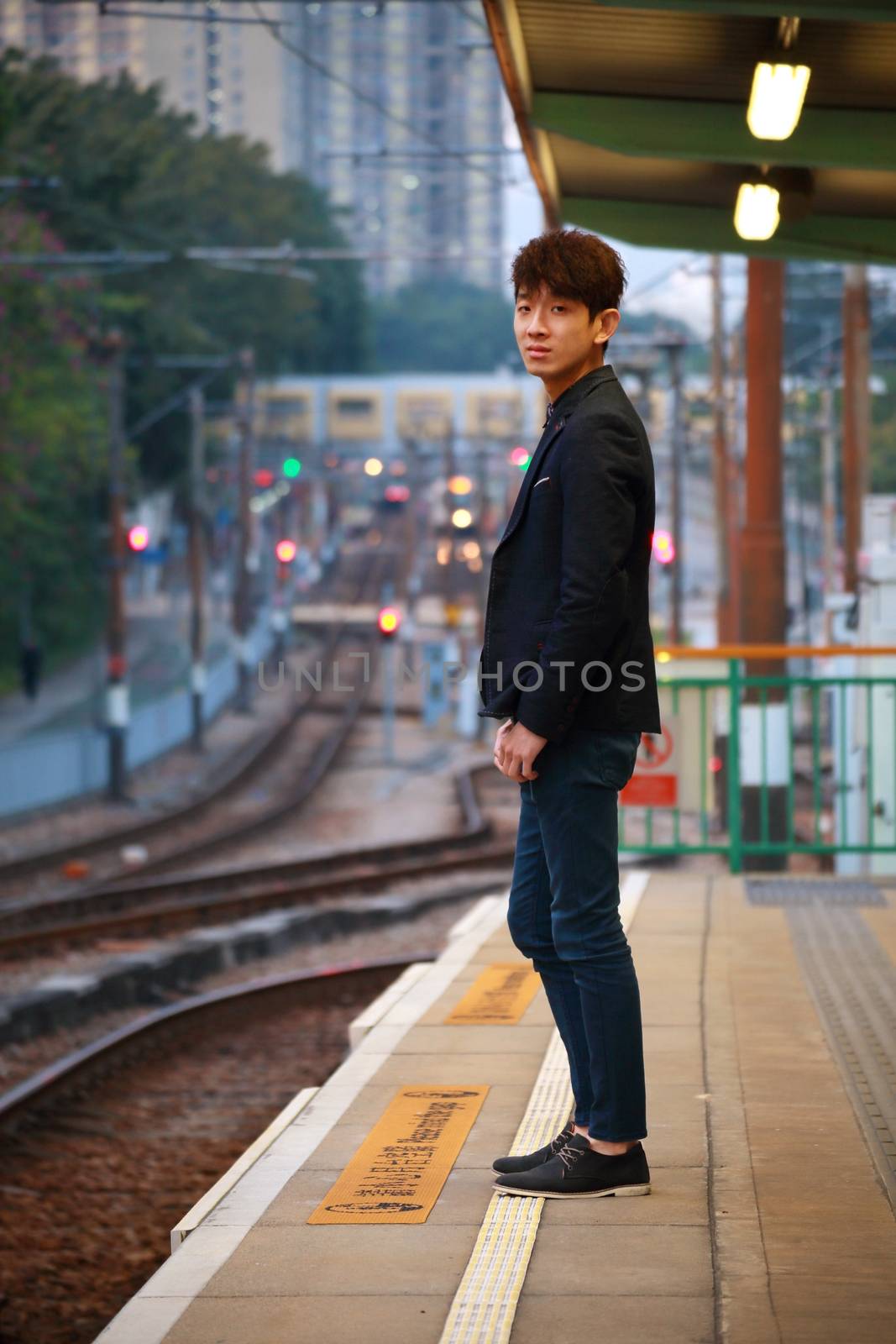 Asia man waiting train at outdoor