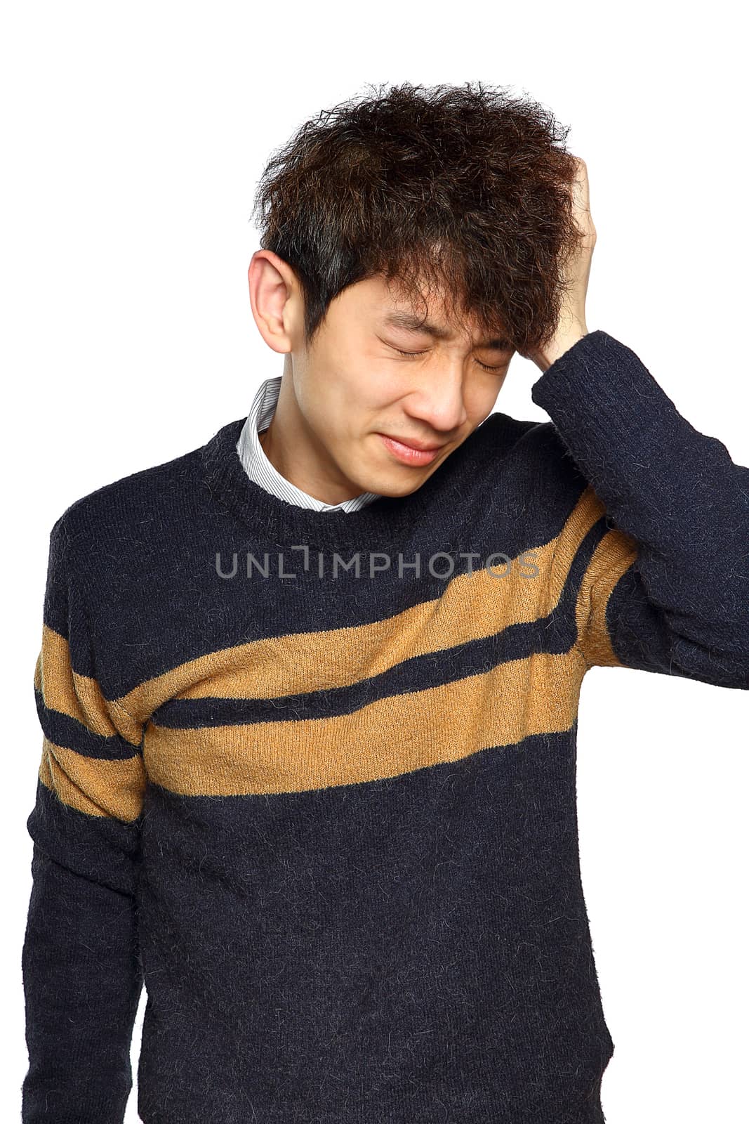 Closeup portrait, stressed young asian man, hands on head with bad headache, isolated background on white. Negative human emotion facial expression feelings.