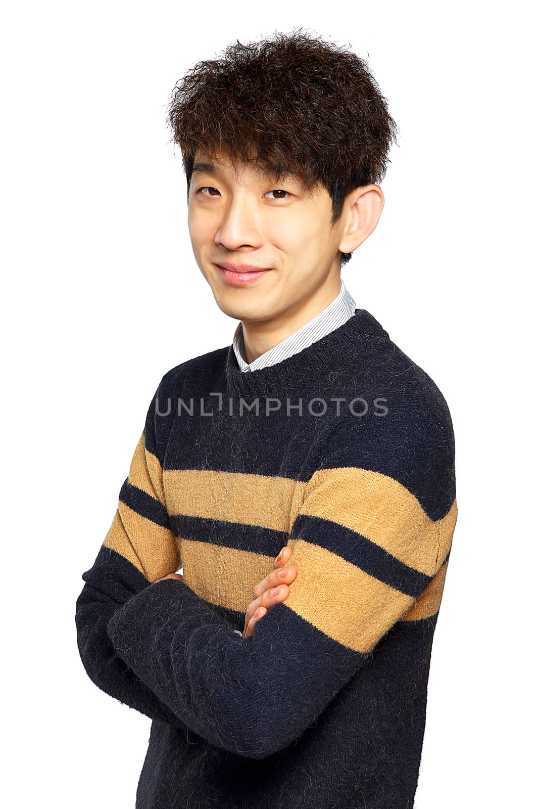 Portrait of happy asian man with arms folded