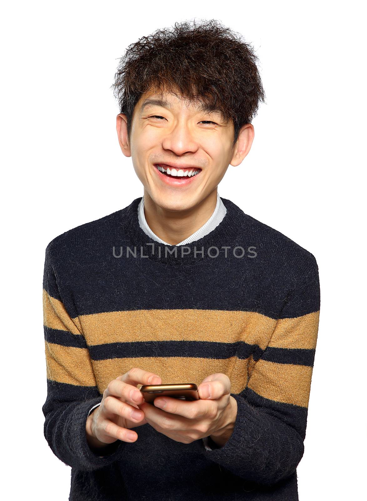 Young man using mobile phone texting on white background