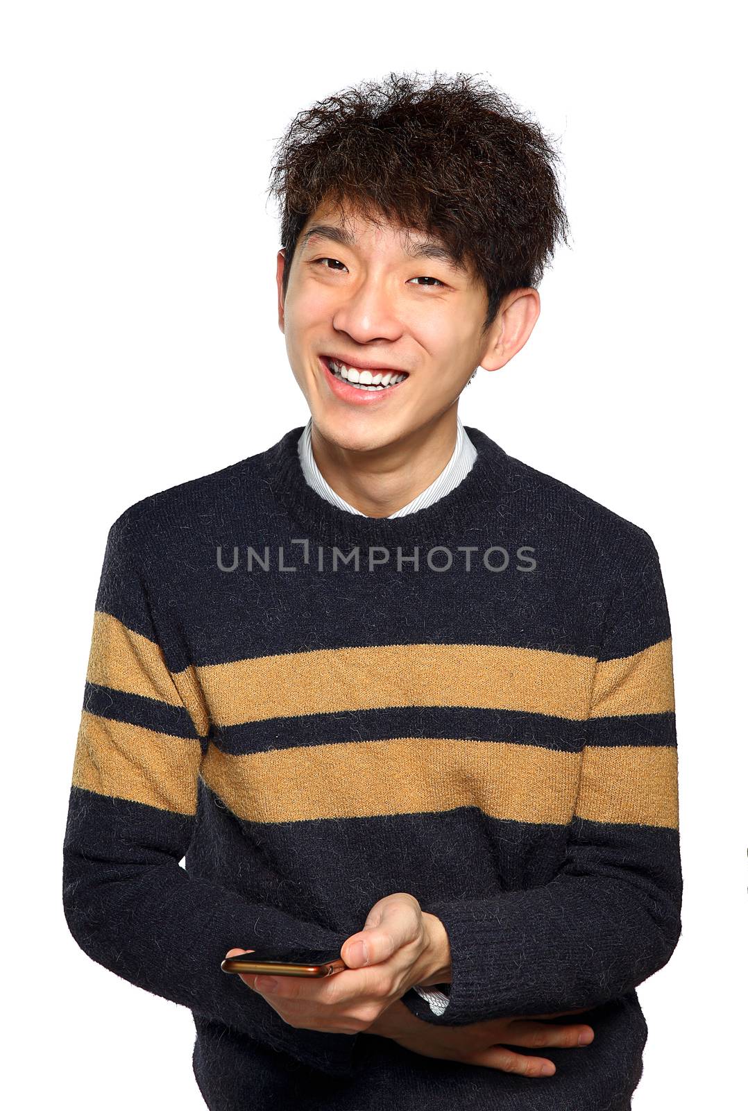Young man using mobile phone texting on white background