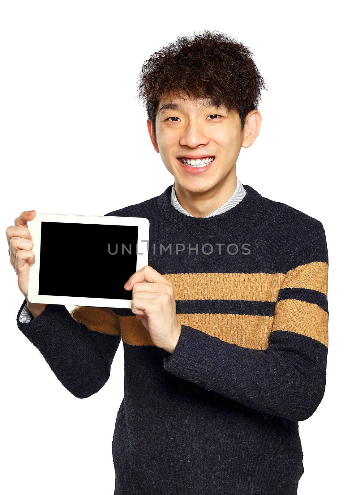 Handsome young Asian man using tablet / pad by cozyta
