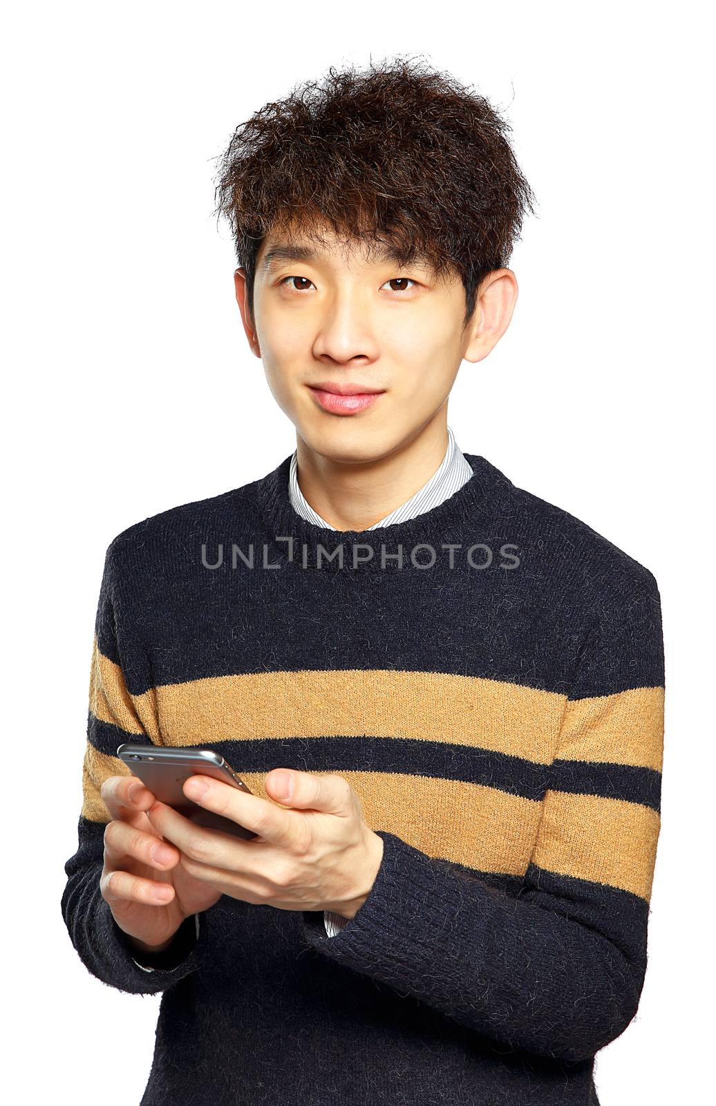 Young man using mobile phone SMS on white background