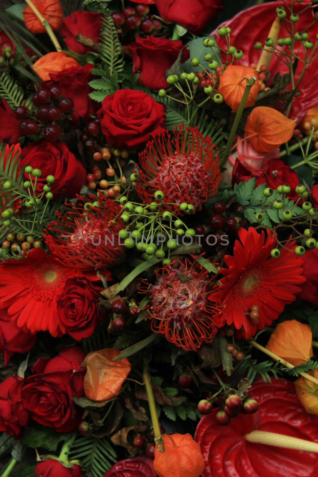 Red bridal arrangement by studioportosabbia