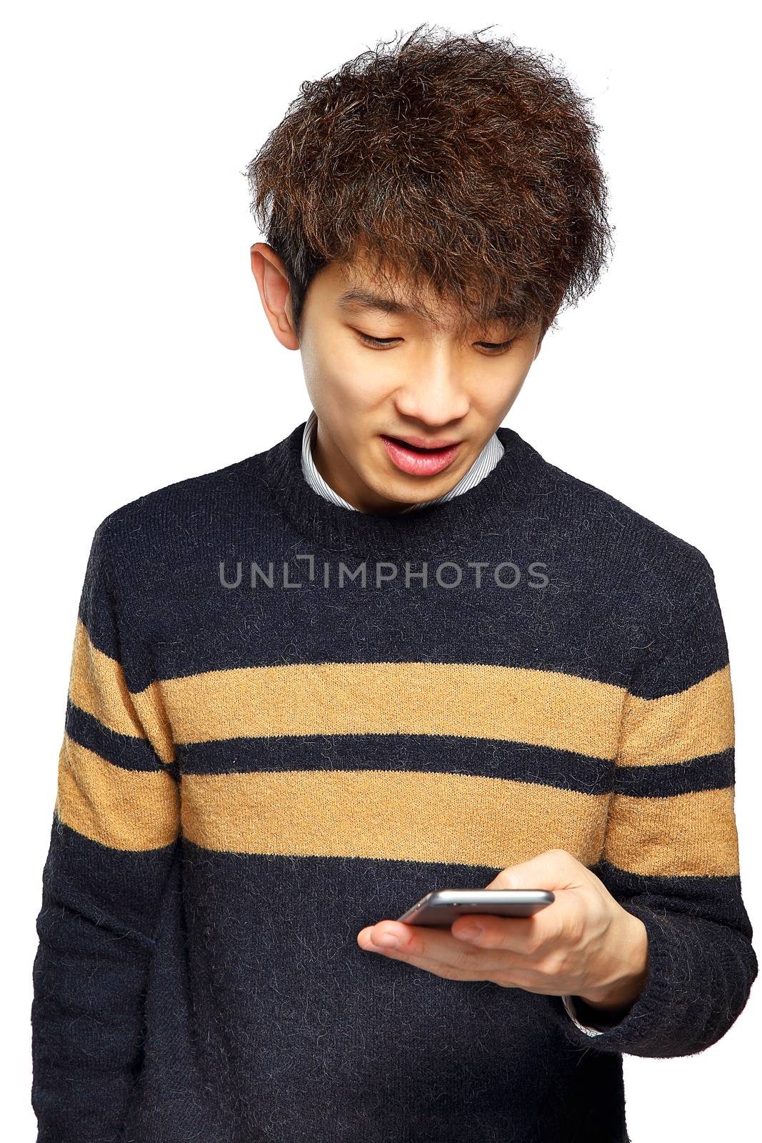 Young man using mobile phone SMS on white background