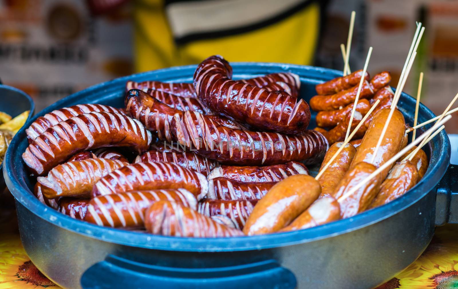 delicious Fried different kinds of sausages on a platter