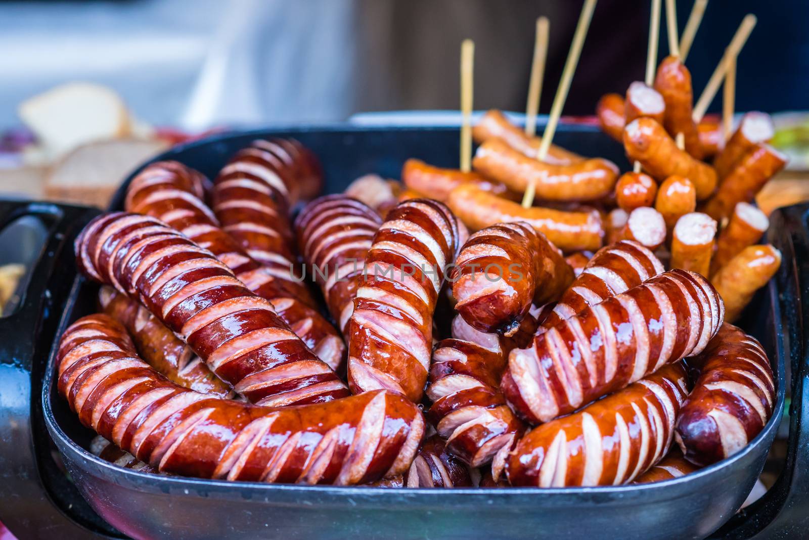 delicious Fried different kinds of sausages on a platter