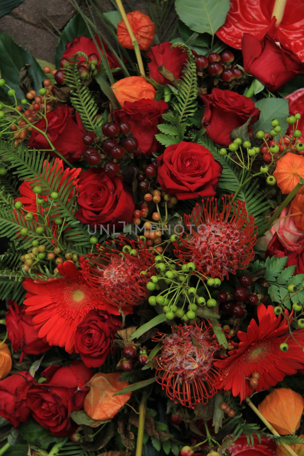 Red bridal arrangement by studioportosabbia