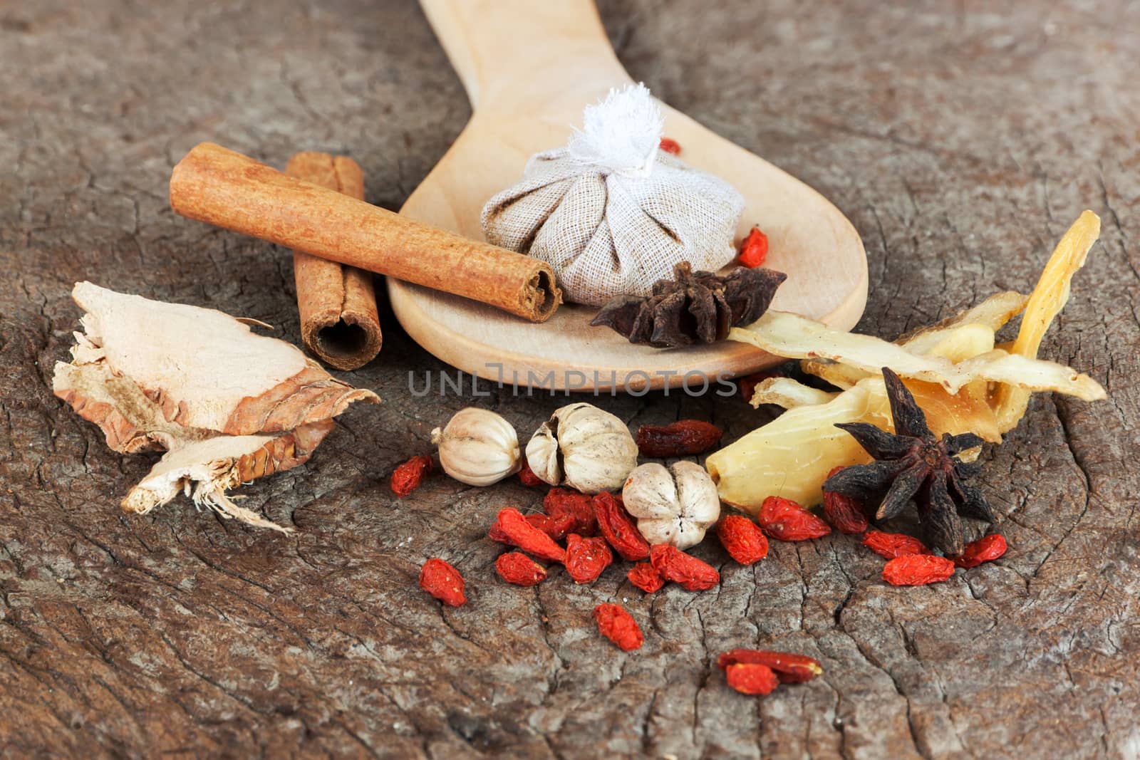 Spices chinese food and herbal wrap for stewed on old wood background