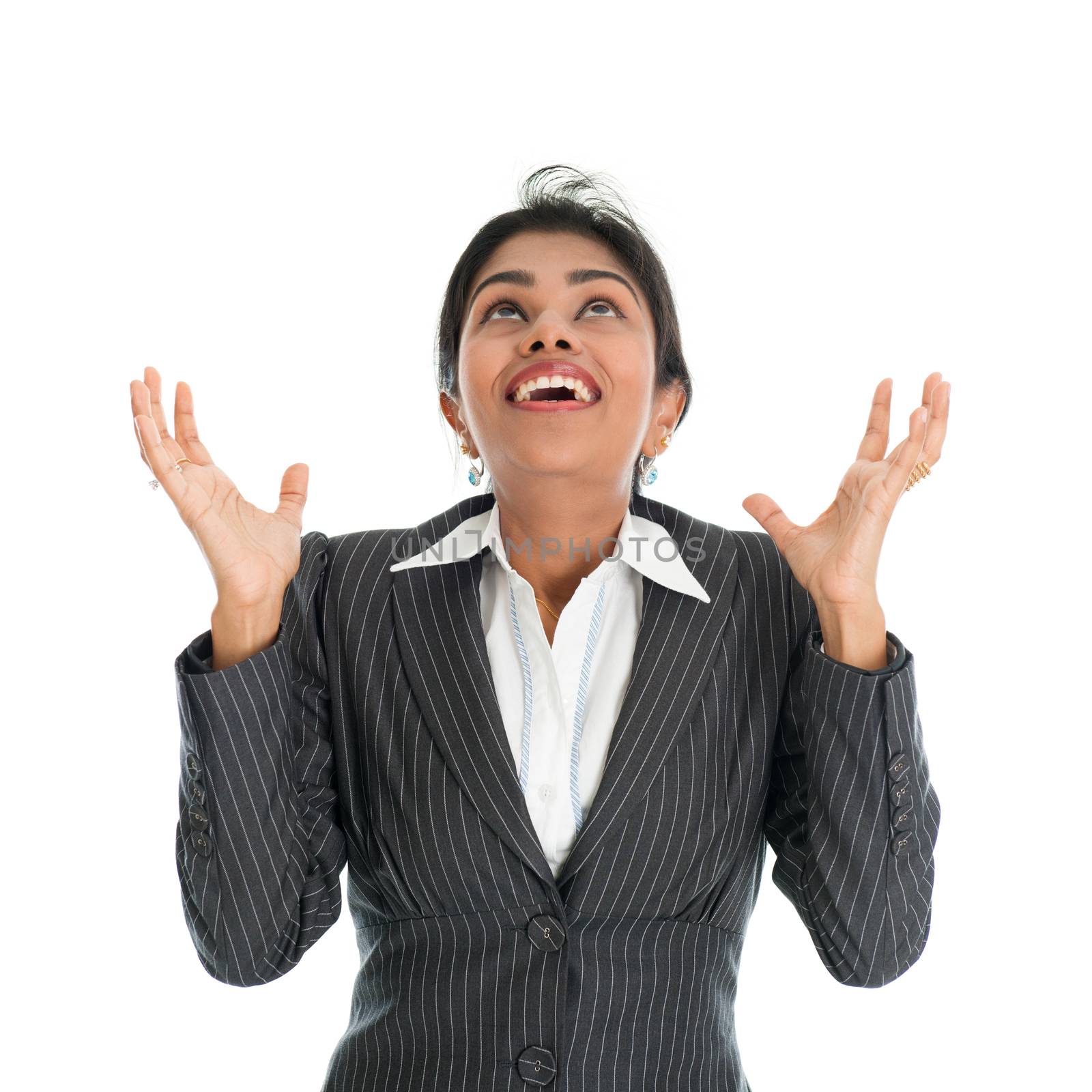 Black woman in formalwear hands open and ready receiving something falling from above, isolated on white background.